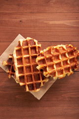 Belgian waffles on a wooden table