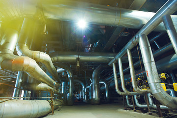 Equipment, cables and piping as found inside of a modern industr