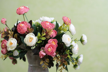 Vintage decorative peonies in vintage vase/can. Artificial flowers. Shabby chic style. Retro. Place for text, copyspace.
