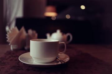 teapot and cup of tea at a cafe