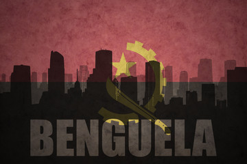 abstract silhouette of the city with text Benguela at the vintage angolan flag