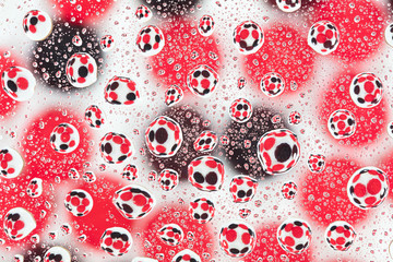 Colorful candies reflected in the water drops.