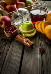 Selection ingredients for autumn and winter sangria on rustic table