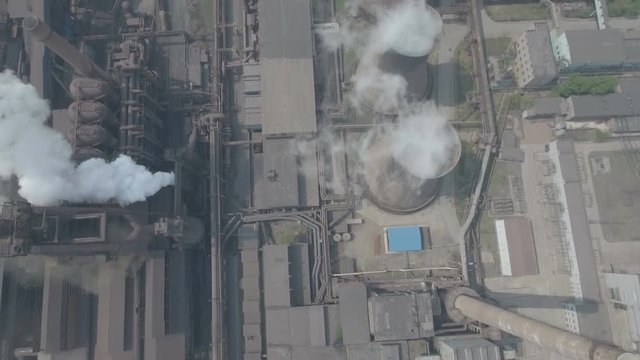 Overhead aerial footage of reactors at steel factory