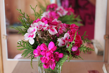 Pink flower stands in a vase
