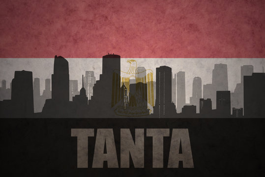 abstract silhouette of the city with text Tanta at the vintage egyptian flag