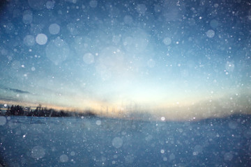blurred winter background with snowflakes for text
