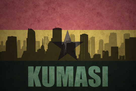 abstract silhouette of the city with text Kumasi at the vintage ghanaian flag