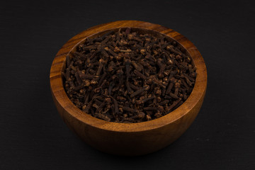Clove spice in wooden bowl