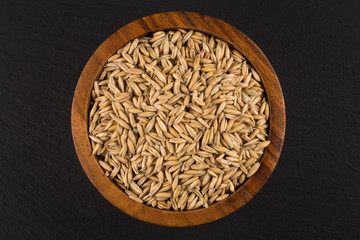 natural oat grains background, closeup