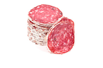 Slices of salami sausage on a white background