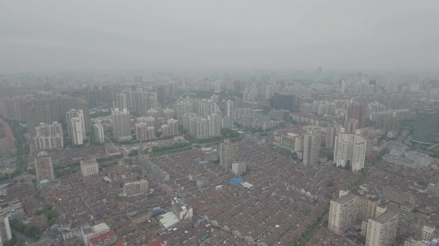 Contrast between low-rise old houses and newer apartment blocks in Shanghai