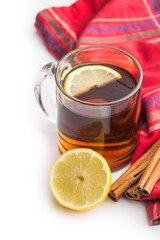 Tea in glass cup with sliced lemon.
