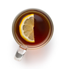 Tea in glass cup with sliced lemon.