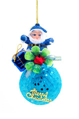 Holiday decoration with Santa Claus siting over Christmas balld on white background.