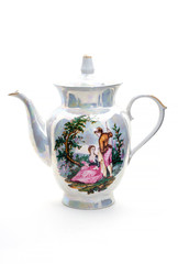 Porcelain teapot with a miniature image isolated on white background.