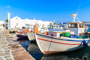 Fototapeta na wymiar Traditional Greek fishing boats in Naoussa port, Paros island, Greece