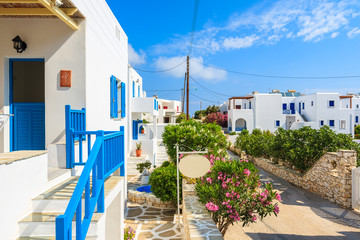 Fototapeta premium View of street with typical Greek houses in Naoussa town, Paros island, Greece