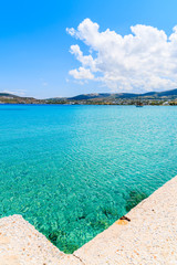 Fototapeta premium Pier and crystal clear azure sea water of Kolymbithres beach, Paros island, Greece