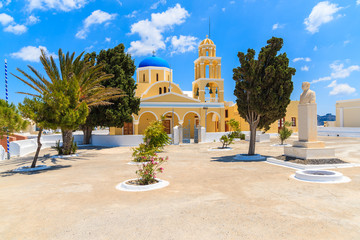 Fototapeta na wymiar Typical church in Oia village on Santorini island, Greece