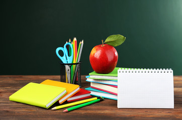 Back to school concept with apple, books and accessories
