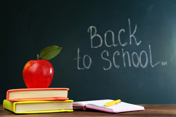 Back to school concept with apple, books and accessories
