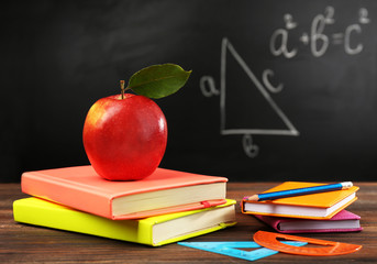 Back to school concept with apple, books and accessories
