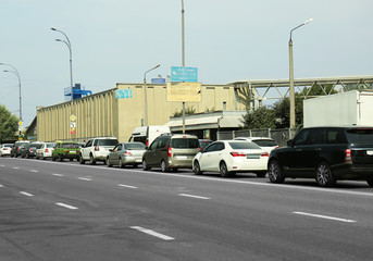 Fototapeta na wymiar Cars in a traffic jam on city street