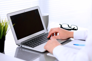 Close-up of Business woman is typing on laptop computer