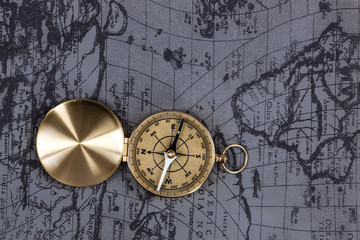 top view, vintage marine compass on the old map, close-up