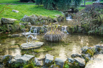 Colorfull italian park with trees and autumn colors and water