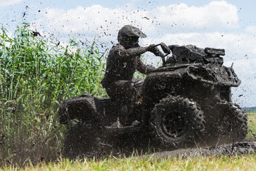 Racing on a dirt atv