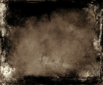 Beautiful abstract vintage grunge background with faded central area for your text or picture, scratched brown background