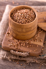 buckwheat groats on wooden surface