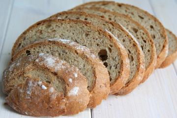 sliced loaf of bread on a white background