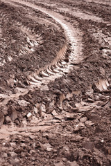 Tractor track marks in the mud