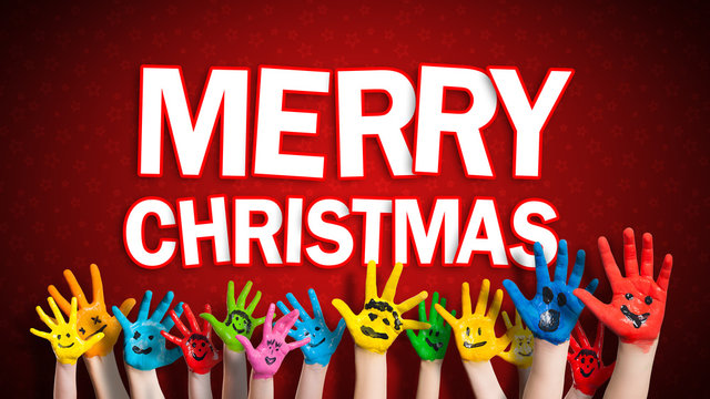 viele angemalte Kinderhände mit Smileys vor weihnachtlichem Hintergrund mit "Merry Christmas" Nachricht