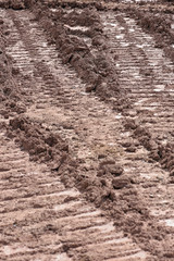 Tractor track marks in the mud