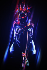 Woman with a neon makeup in ultraviolet light - obrazy, fototapety, plakaty