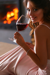 Sexy girl in front of the fireplace