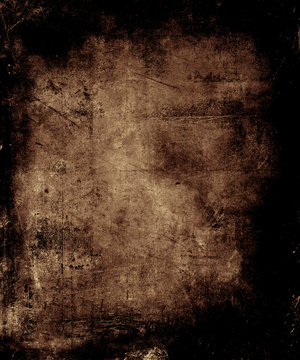 Scary abstract vintage grunge background with faded central area for your text or picture, scratched halloween brown background
