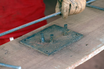Construction worker assembling iron frame