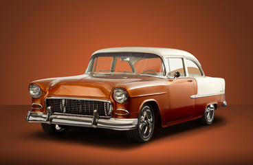 Obraz na płótnie Canvas Vintage 1955 Chevrolet Bel Air - Orange Background