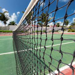 Outdoor tennis net at court with nobody