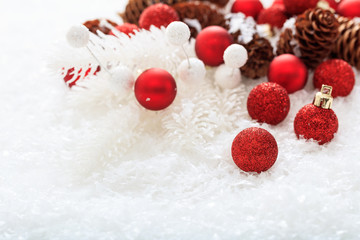 Fototapeta na wymiar Christmas balls and snow on white background