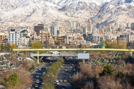 Winter Tehran view with a snow covered Alborz Mountains on backg