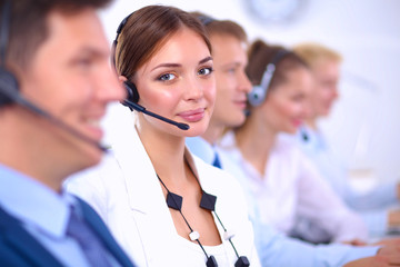 Smiling positive young businesspeople and colleagues in a call center office