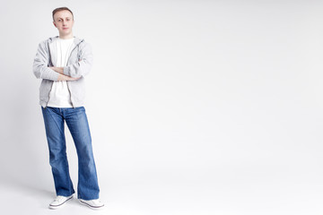 Full Length Portrait of Caucasian Man in Casual Clothing Posing against White