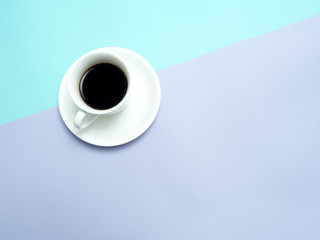 Obraz na płótnie Canvas Top view of colorful cup of coffee on color blue and pink background for create idea for business or design .Relax coffee time . (flat lay)