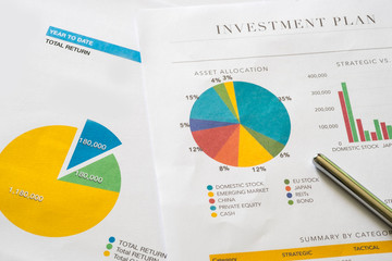 Investment planning and reporting concept. Closed up of invesment planning report containing...